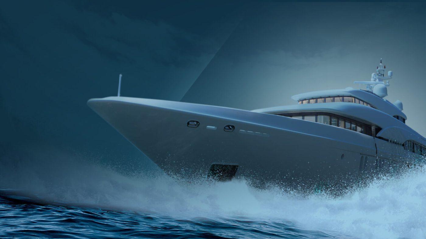 superyacht cresting a wave