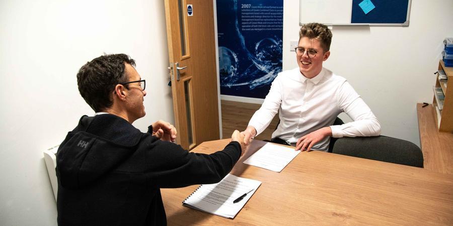 men shaking hands after an interview