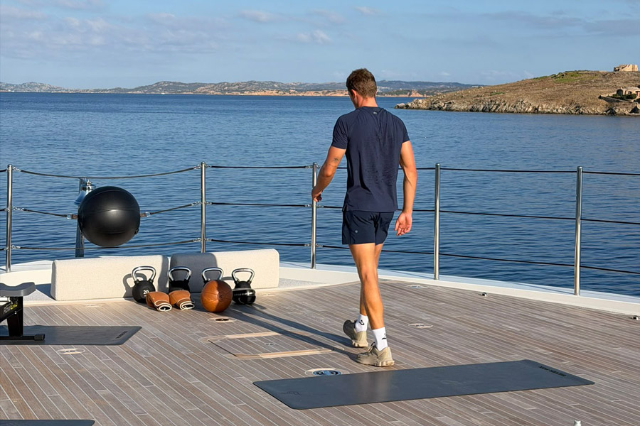 Harry personal training on a superyacht